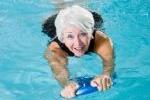 Older woman swimming in a pool